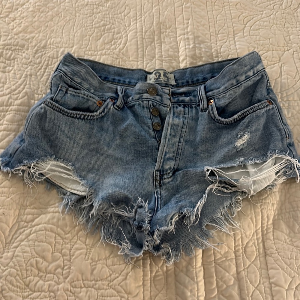 Free people ripped Jean shorts - size 25